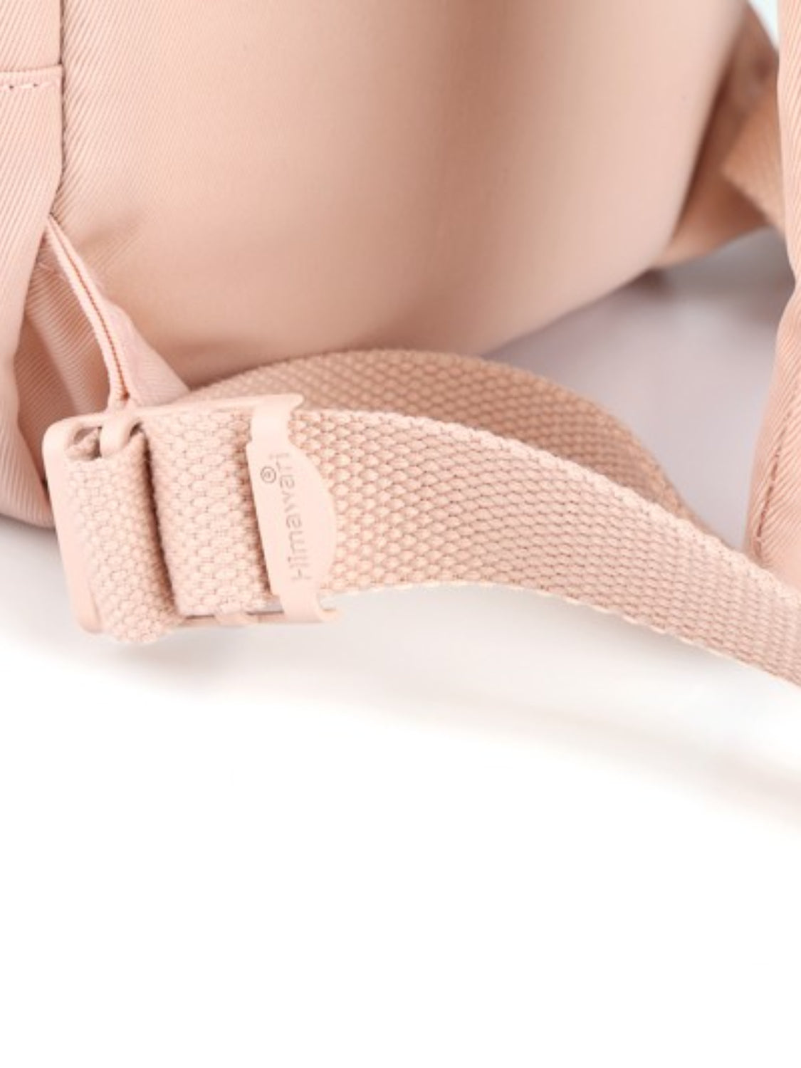 Close-up of the Himawari backpack's adjustable strap with brand detail, ensuring a comfortable and secure fit.