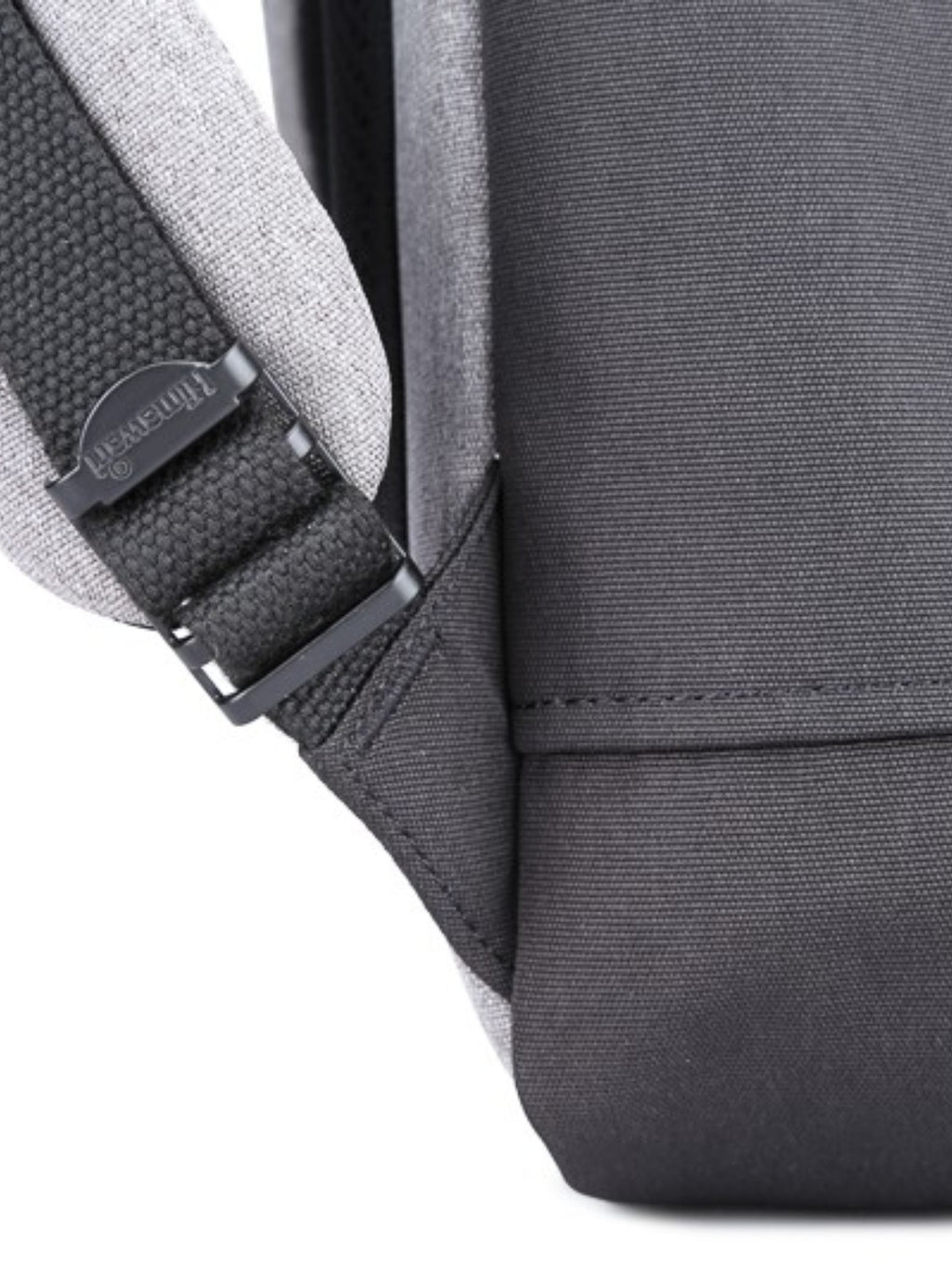 Close-up of the side strap and stitching on the Himawari waterproof canvas backpack, highlighting its durability.