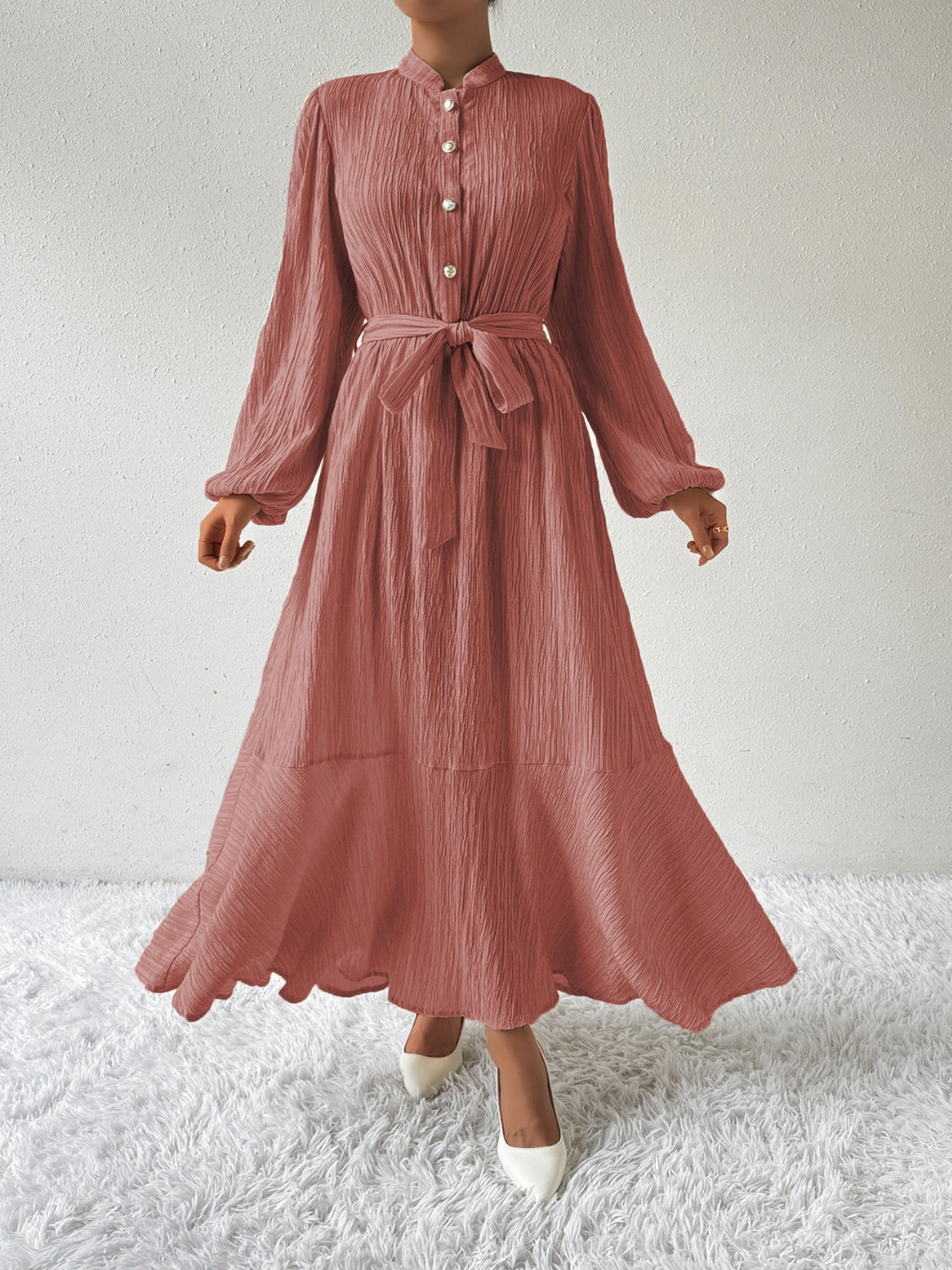 Honey tie waist long sleeve dress in a soft pink tone with button front detail. Made from a comfortable viscose blend, perfect for versatile fashion.