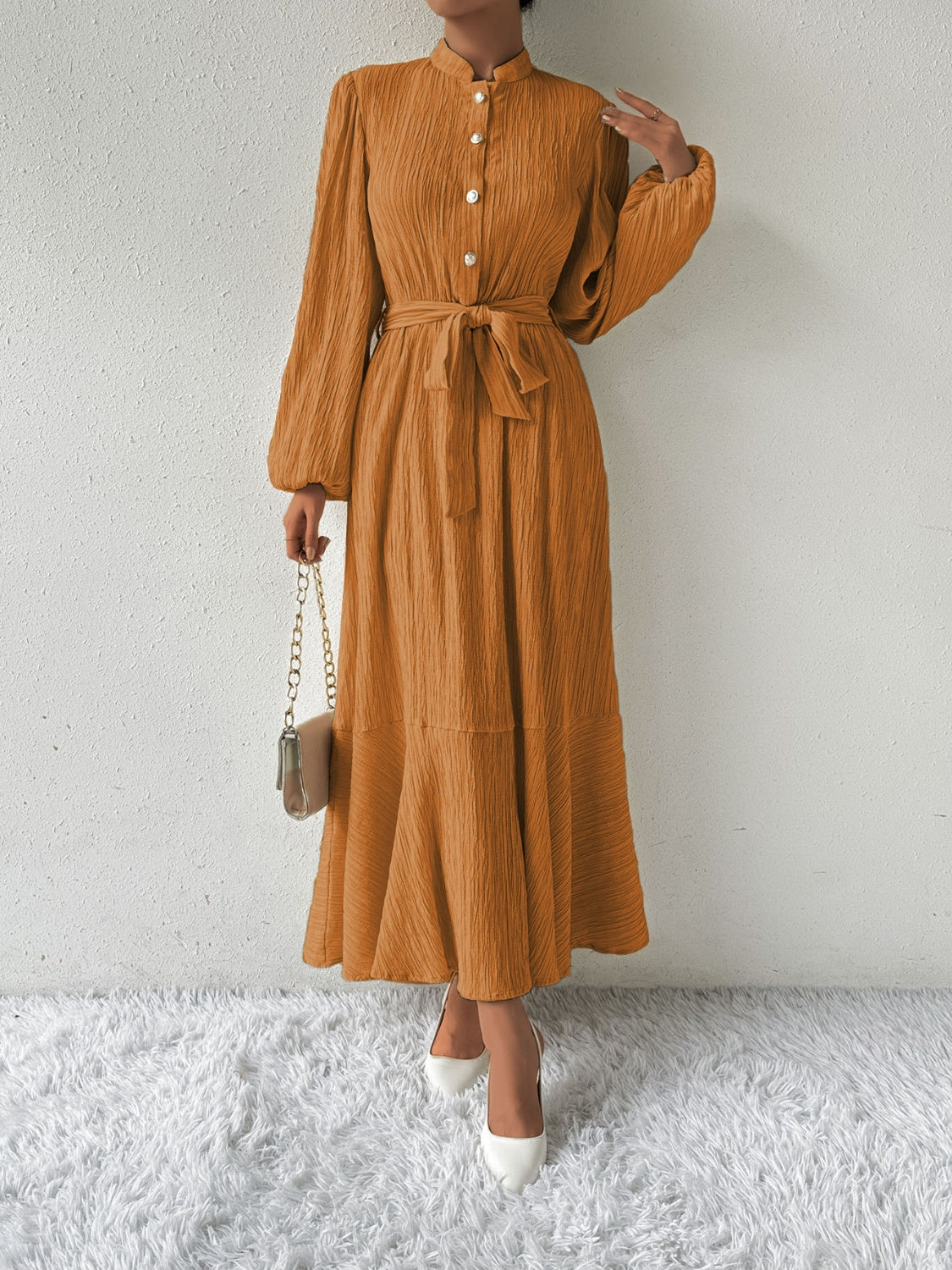 Honey tie waist long sleeve dress in a warm orange tone, featuring button front detail and a flowing maxi silhouette. Available in sizes S-XL for versatile fashion.