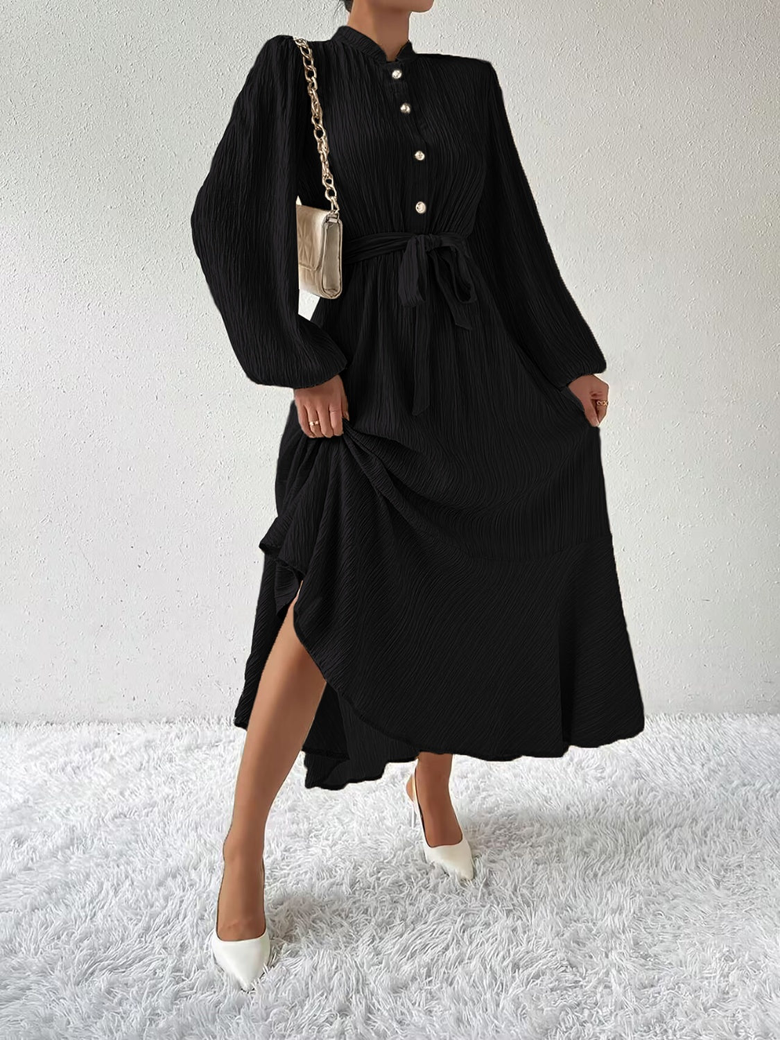 Honey tie waist long sleeve dress in black with button front design. Elegant midi length, featuring a flowy silhouette and versatile style.