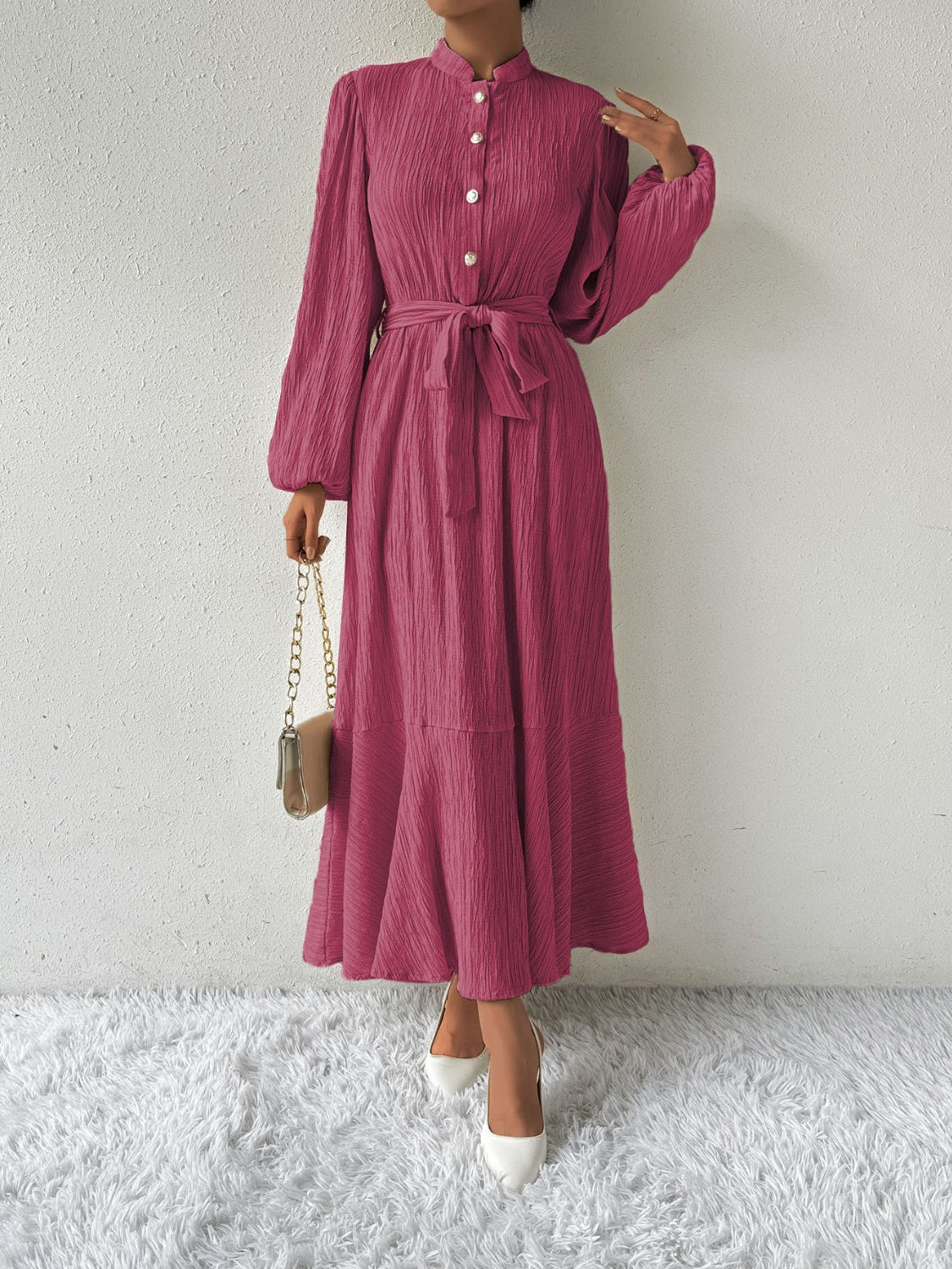 Honey tie waist long sleeve dress in a vibrant pink shade, featuring a button front and flowy design. Available in sizes S-XL for versatile fashion.