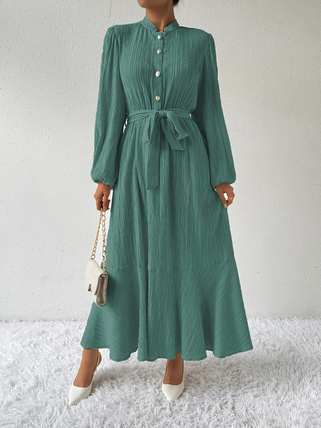 Honey tie waist long sleeve dress in green with button front and pleated texture. Elegant maxi design, available in sizes S-XL.