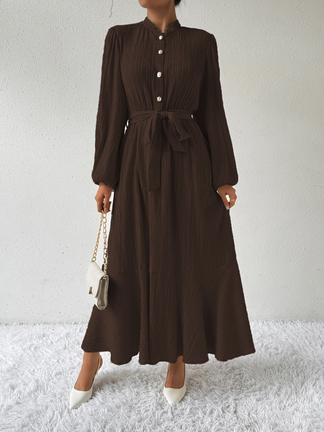 Honey tie waist long sleeve dress in dark brown with button front and maxi length. Made from a comfortable viscose blend, perfect for versatile fashion.