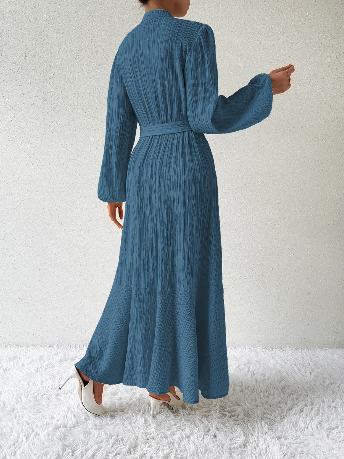 Honey Tie Waist Long Sleeve Dress in blue with a textured fabric, featuring a belted waist and flowing maxi length. Elegant and versatile fashion for sizes S-XL.