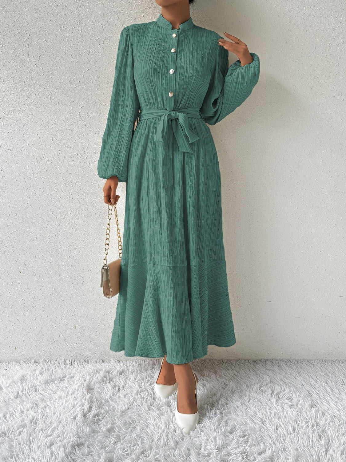 Honey tie waist long sleeve dress in green with button front and flowy silhouette. Made from a comfortable viscose blend, perfect for versatile fashion.